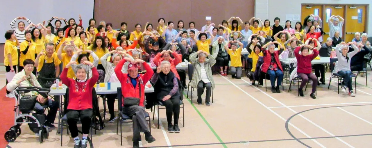 Carefirst_womens_group_mothers_day-celebration_Yummy_Yummy_Lunch_2025_seniors_made_heart_shape_gesture