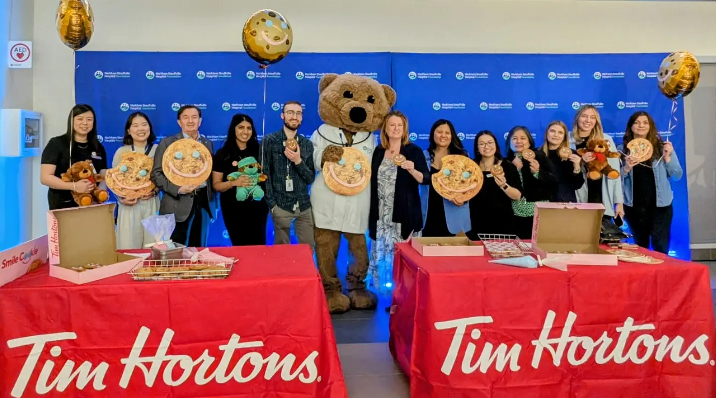Tim_Hortons_Smile_Cookie_funderaising_campaign_2025_guest_&_staff_Smile_Cookie_decorating_group_photo