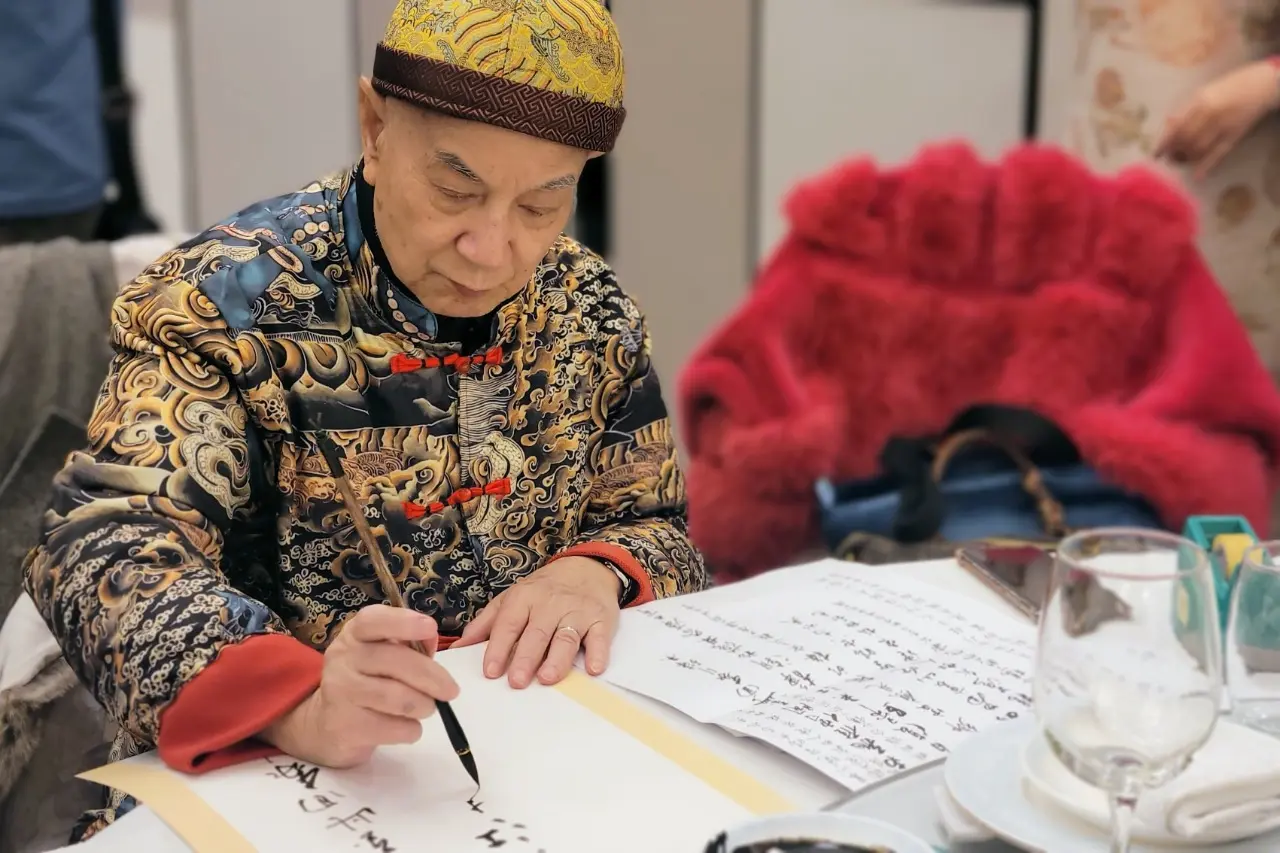 Leung_exhibition_teacher_work_on_his_artwork